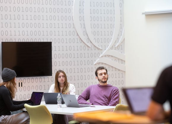 Students in a room in the School of Computing and Engineering