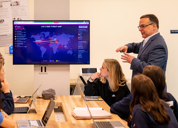 Quinnipiac University Professors engage in discussion with students on Tuesday, June 6, 2023 in the Communications, Computing and Engineering building on the Mount Carmel Campus.